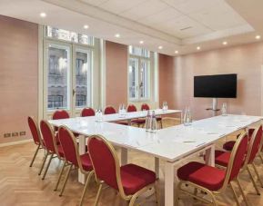 Meeting room with TV screen and u shape table at the DoubleTree by Hilton Trieste.