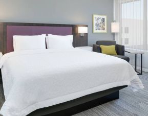 spacious king room with lounger and work area at Hampton Inn Irvine Spectrum Lake Forest.