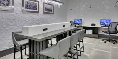 business center and coworking space equipped with work desks, PC, internet, and printers at Hampton Inn Irvine Spectrum Lake Forest.