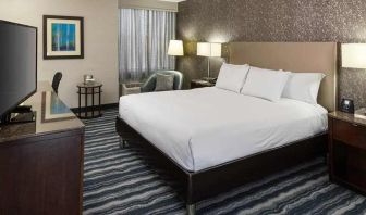 comfortable king room with TV and work desk ideal for working remotely at DoubleTree by Hilton Hotel Wilmington.