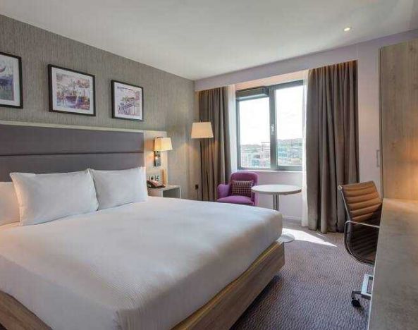 King guestroom with working station at the Hilton Garden Inn Dublin Custom House.