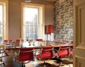 Elegant meeting room with square table at the Morrison, a DoubleTree by Hilton Hotel.