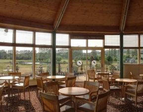 Restaurant area with view at the Hilton Belfast Templepatrick Golf & Country Club.