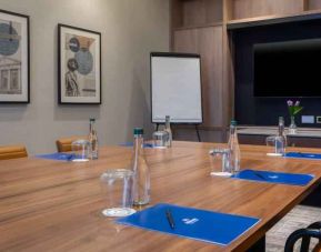 Small meeting room with square table at the Hilton Dublin Airport.