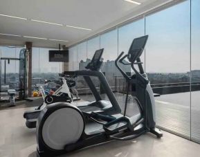 Fitness center with treadmills at the Hilton Garden Inn Jakarta Taman Palem.
