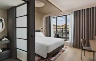 Bright balcony with desk at the Canopy by Hilton Paris Trocadero.