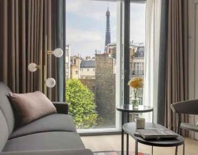 Living room overlooking the tour eiffel at the Canopy by Hilton Paris Trocadero.