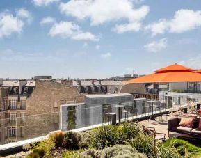 Beautiful outdoor terrace overlooking the city and the tour eiffel at the Canopy by Hilton Paris Trocadero.