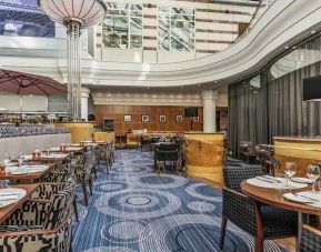 Restaurant area suitable as workspace at the Hilton Paris Charles de Gaulle Airport.