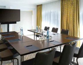 Meeting room with small u shape table at the Hilton Paris Opera.