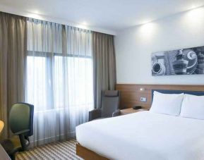King bedroom with desk at the Hampton by Hilton Amsterdam Airport Schiphol.