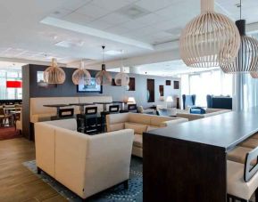 Comfortable lobby workspace at the Hampton by Hilton Amsterdam Airport Schiphol.