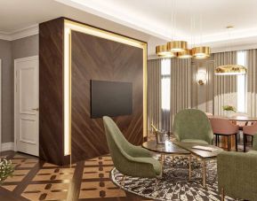 Living room with table, chairs and sofa at the Hotel Saski Krakow Curio Collection by Hilton.