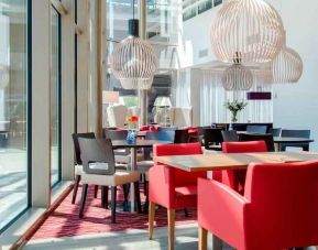 Hotel workspace with chairs and tables at the Hampton by Hilton Amsterdam Arena Boulevard.