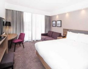 delux king bed with TV and work desk at Hampton by Hilton Blackpool.