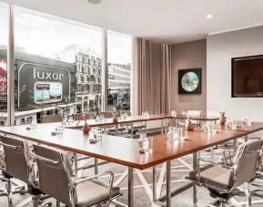 Brigh meeting room with large windows at the Hilton Rotterdam.