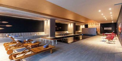 gorgeous indoor pool with sun beds at Hilton Bogota Corferias.