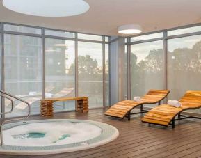 relaxing indoor jacuzzi with pool beds at Hilton Garden Inn Bogota Airport.