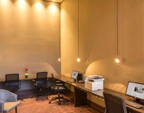 dedicated business center with PC, internet, work desks, and printer at Hilton Garden Inn Bogota Airport.