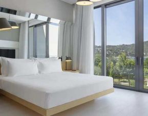 spacious king room with lots of natural light at Susona Bodrum, LXR Hotels & Resorts.