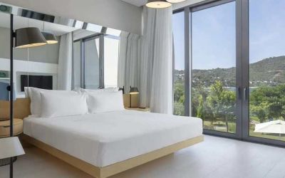spacious king room with lots of natural light at Susona Bodrum, LXR Hotels & Resorts.