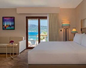 beautiful king suite with lounge and sea views at DoubleTree by Hilton Bodrum Isil Club Resort.