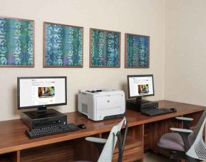 Business center with computers and printer at the Hilton Garden Inn Tanger City Center.