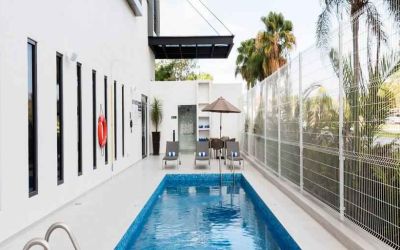 Relaxing outdoor pool at the Hampton Inn by Hilton Cancun Cumbres.