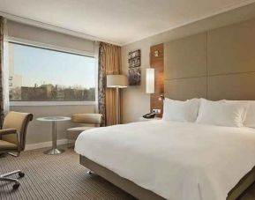 spacious king room with TV and work desk at Hilton Barcelona.