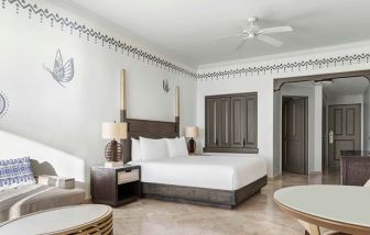 Spacious and comfortable king suite at the Hilton Los Cabos Beach & Golf Resort.