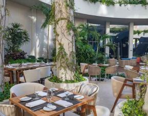 Outdoor patio perfect as workspace at the Hilton Garden Inn Cancun Airport.