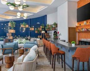 Comfortable lobby workspace at the Hilton Garden Inn Cancun Airport.