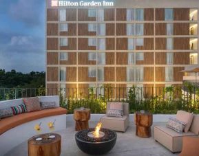 Terrace with firepit suitable for co-working at the Hilton Garden Inn Cancun Airport.