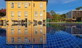 Outdoor patio suitable for co-working at the Boeira Garden Hotel Porto Gaia, Curio Collection by Hilton.