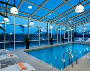 beautiful indoor pool with sunbeds at Adana HiltonSA.