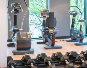 Fitness center with weights and machines at the Hampton by Hilton Warsaw Mokotow.