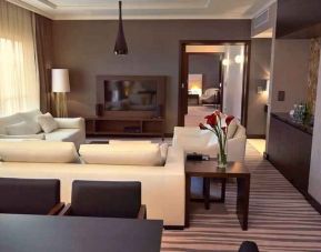 Spacious living room in a hotel suite at the DoubleTree by Hilton Lodz.