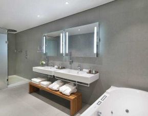 Spacious guest bathroom at the Legend Hotel Lagos Airport, Curio Collection by Hilton.