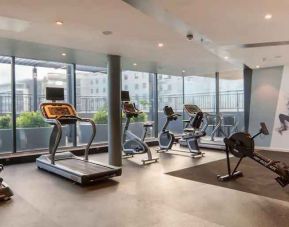 Fitness center with large windows at the Hilton Garden Inn Umhlanga Arch.