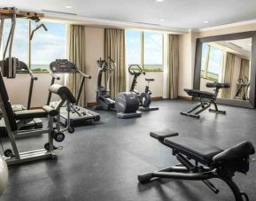 Bright fitness center with windows at the Hilton Garden Inn Al Jubail.