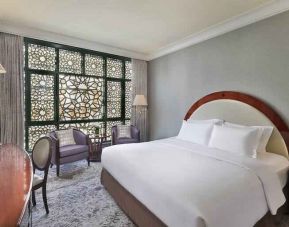 King bedroom with desk at the Madinah Hilton Hotel.