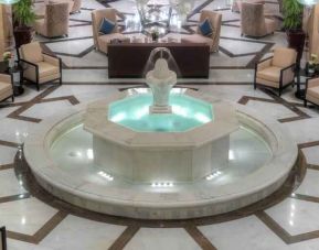 Lobby workspace with fountain at the Hilton Suites Makkah.