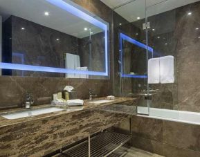 spacious king bathroom with shower and bath at Hilton Garden Inn Istanbul Ataturk Airport.