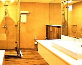 clean and spacious bathroom with shower at DoubleTree by Hilton Nairobi Hurlingham.