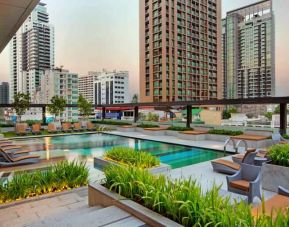 Outdoor pool area suitable as workspace at the DoubleTree by Hilton Sukhumvit Bangkok.