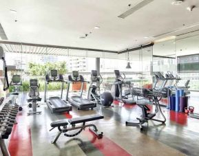 Fully equipped fitness center at the DoubleTree by Hilton Sukhumvit Bangkok.