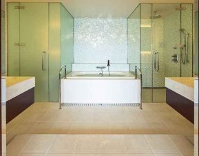 clean and spacious king bathroom with bath and shower at Hilton Fukuoka Sea Hawk.
