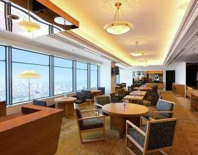 comfortable and spacious lobby and coworking space with lovely city views at Hilton Fukuoka Sea Hawk.