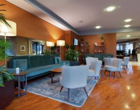 comfortable and spacious lobby and coworking space at Hilton Garden Inn Milan Malpensa.
