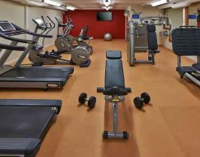 Fitness center with treadmills and machines at the Hilton Zurich Airport.